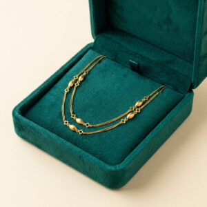 Collana lunga in oro giallo 18 kt con decori geometrici